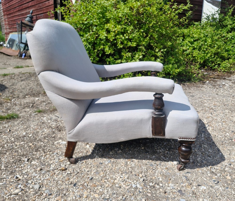 Edwardian low seat upholstered armchair in the Howard style.  View III