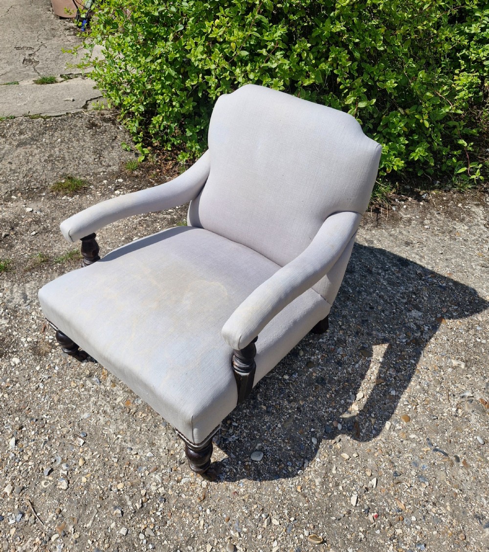Edwardian low seat upholstered armchair in the Howard style.  View IV