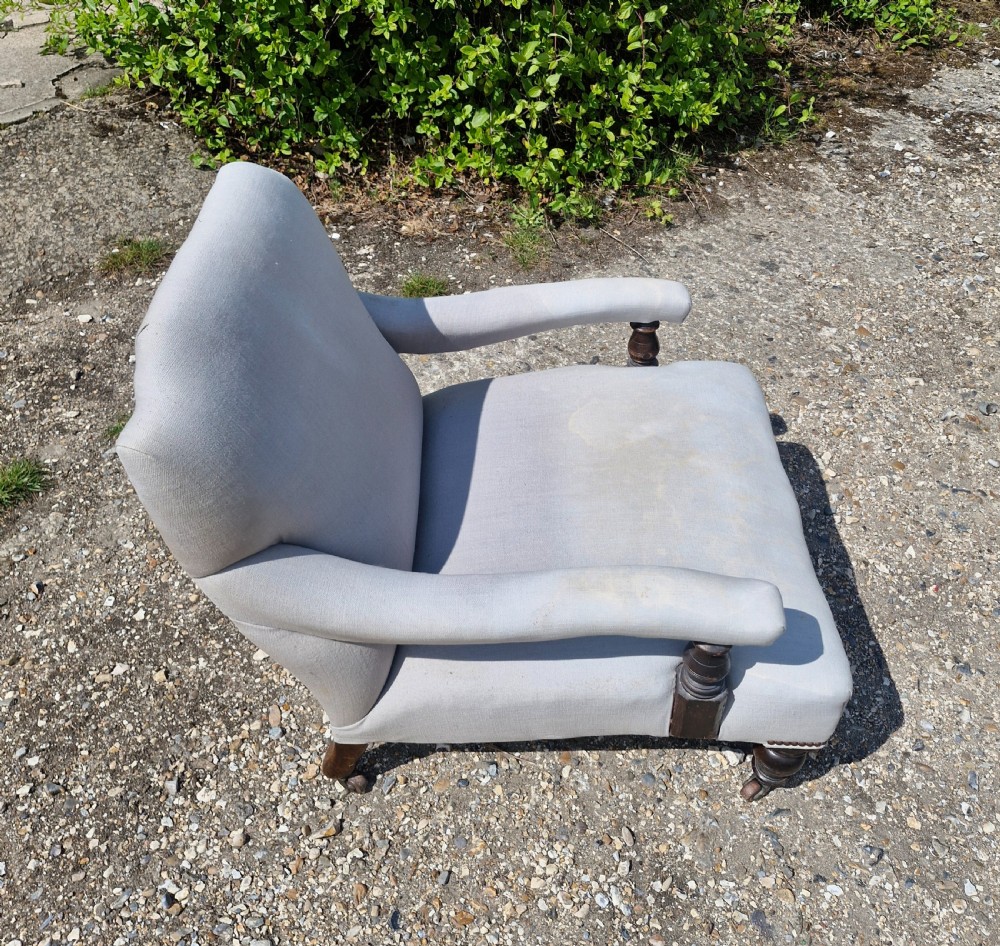 Edwardian low seat upholstered armchair in the Howard style.  View V