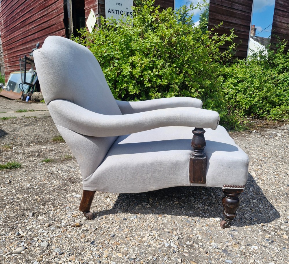 Edwardian low seat upholstered armchair in the Howard style.  View VI
