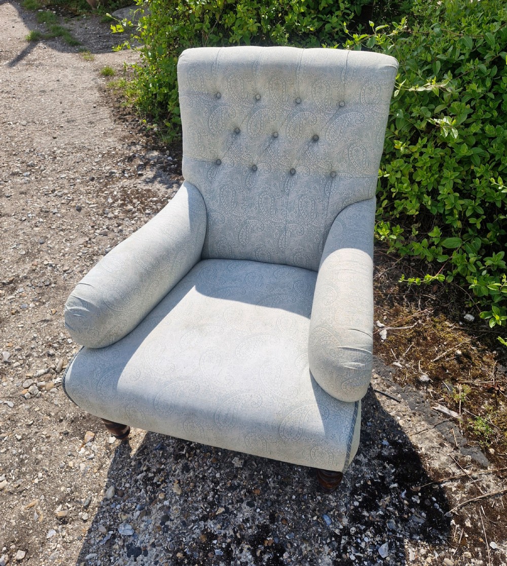 Upholstered button back armchair.  View II
