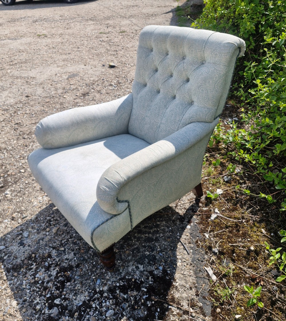 Upholstered button back armchair.  View III