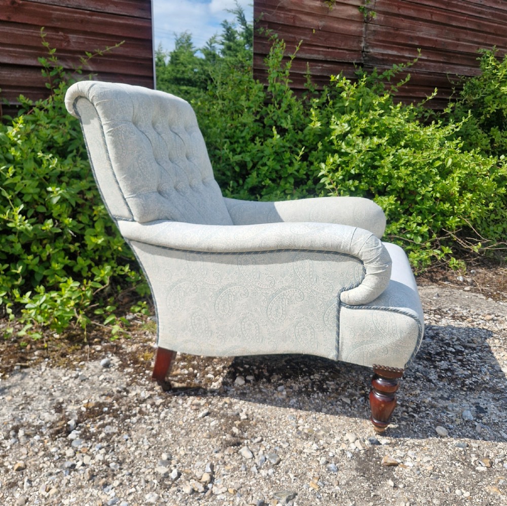 Upholstered button back armchair.  View V