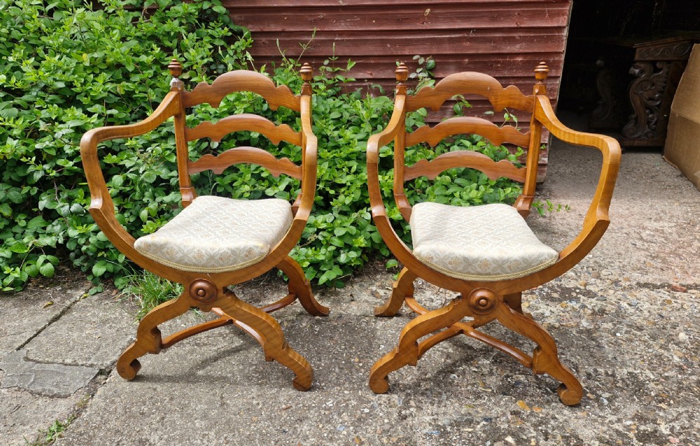 Pair of Victorian armchairs after a Gillows design, makers name.
