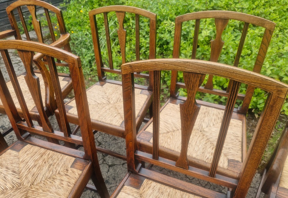 Set of 8 East Anglian rush seat dining chairs.  View IX