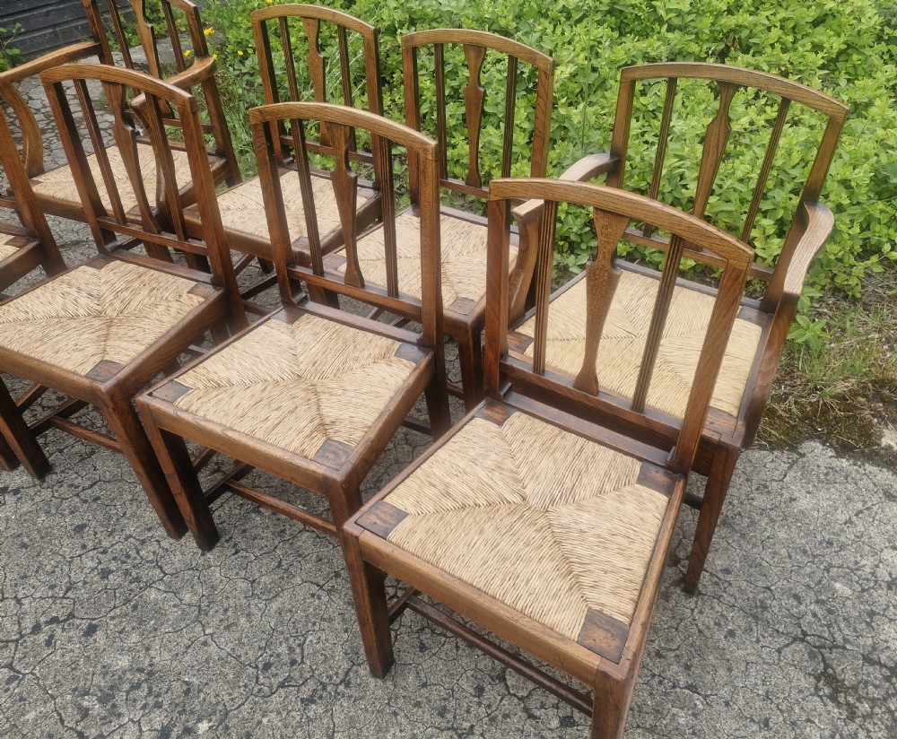 Set of 8 East Anglian rush seat dining chairs.  View XI