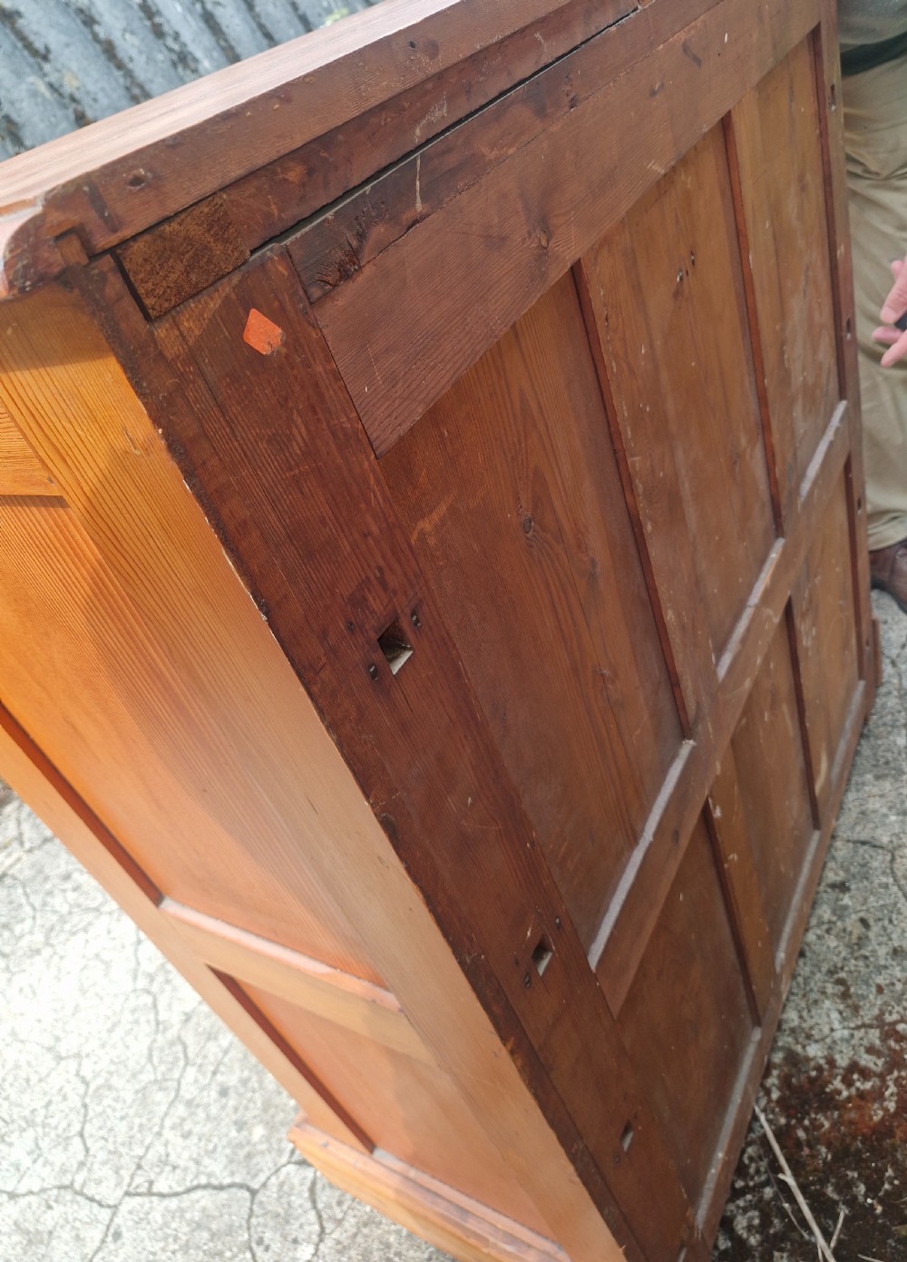 An Edwardian pine chest of drawers featuring a two-over-three drawer configuration with brass drop handles and a plinth base. View III