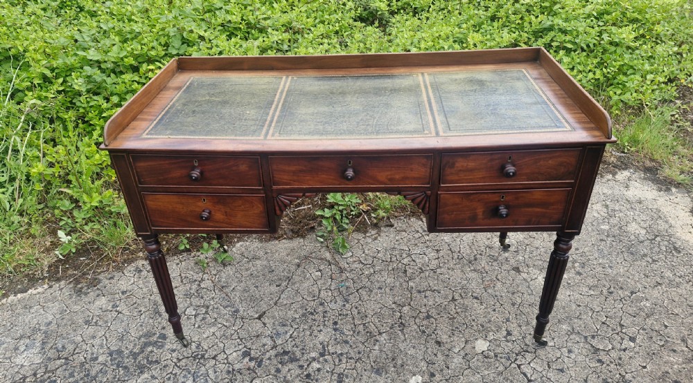 Regency mahogany writing table with a Gillows style legs.