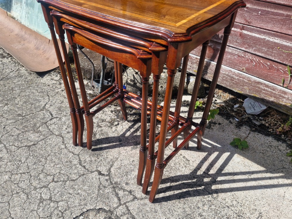 Nest of 3 inlaid mahogany occasional tables.  View II