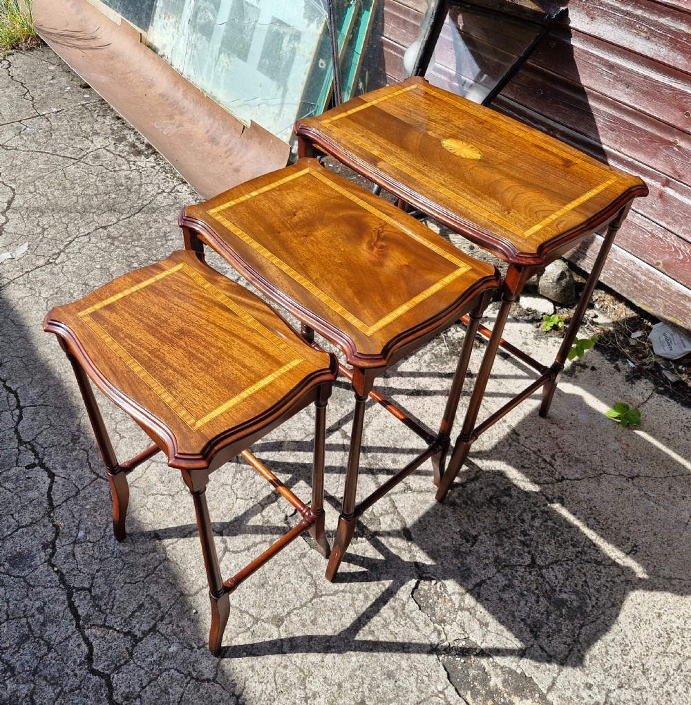Nest of 3 inlaid mahogany occasional tables.  View III