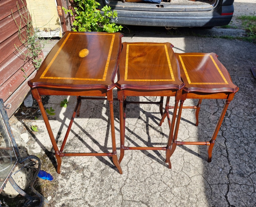 Nest of 3 inlaid mahogany occasional tables.  View IV