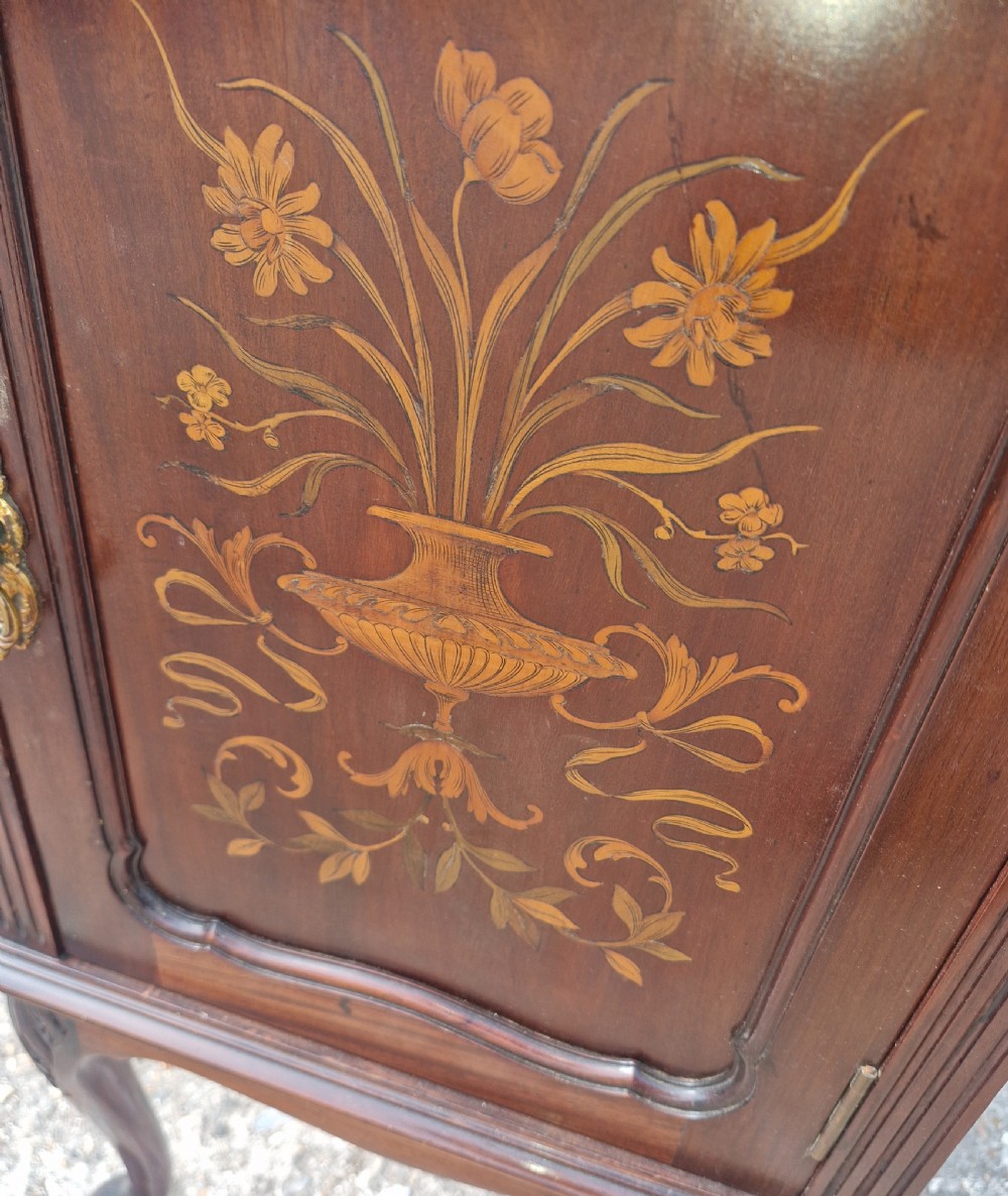 A late Victorian dark mahogany bedside cabinet featuring floral marquetry inlay on the door and gallery splashback. View III