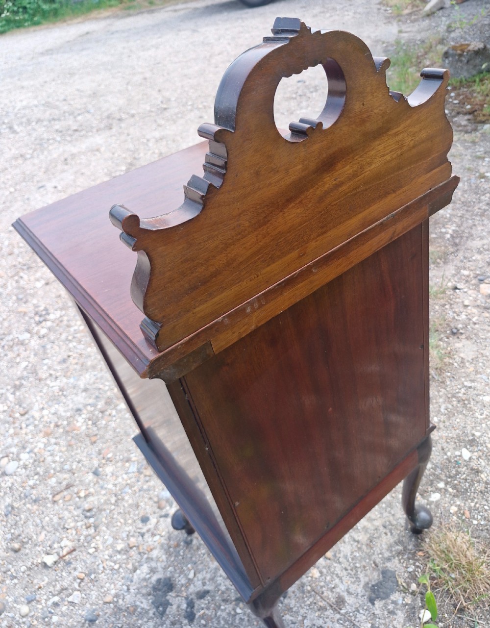 A late Victorian dark mahogany bedside cabinet featuring floral marquetry inlay on the door and gallery splashback. View VII