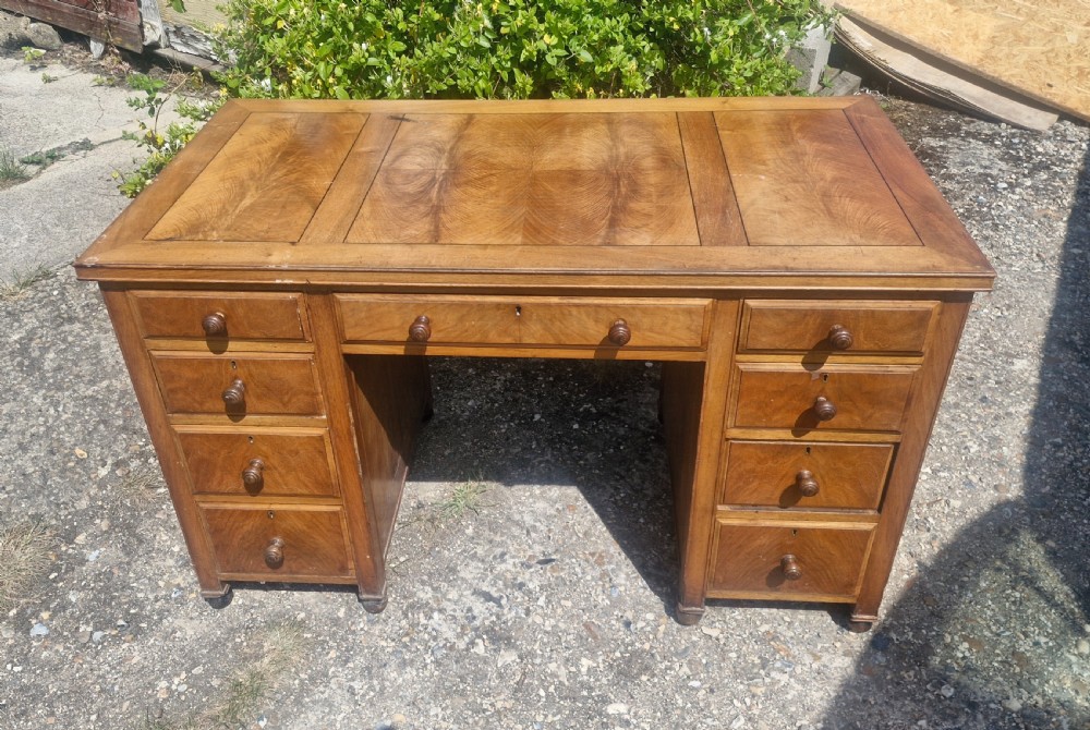 Walnut kneehole pedestal writing desk by Heals. View II