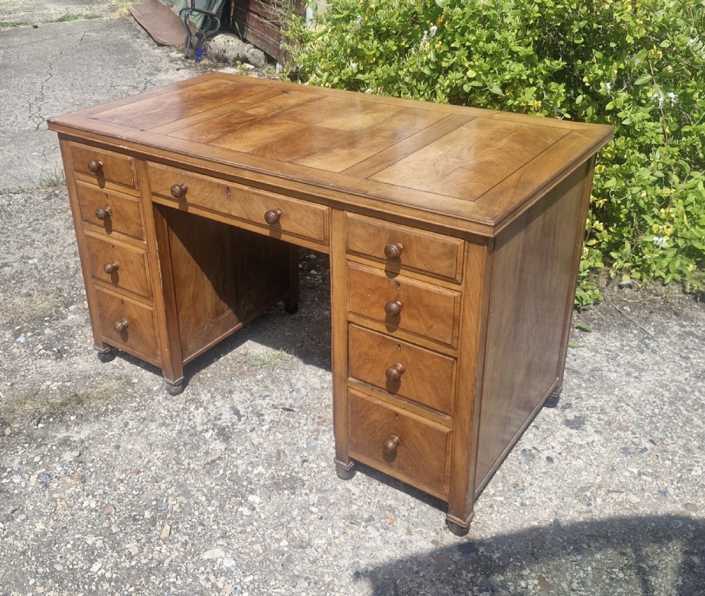 Walnut kneehole pedestal writing desk by Heals. View III
