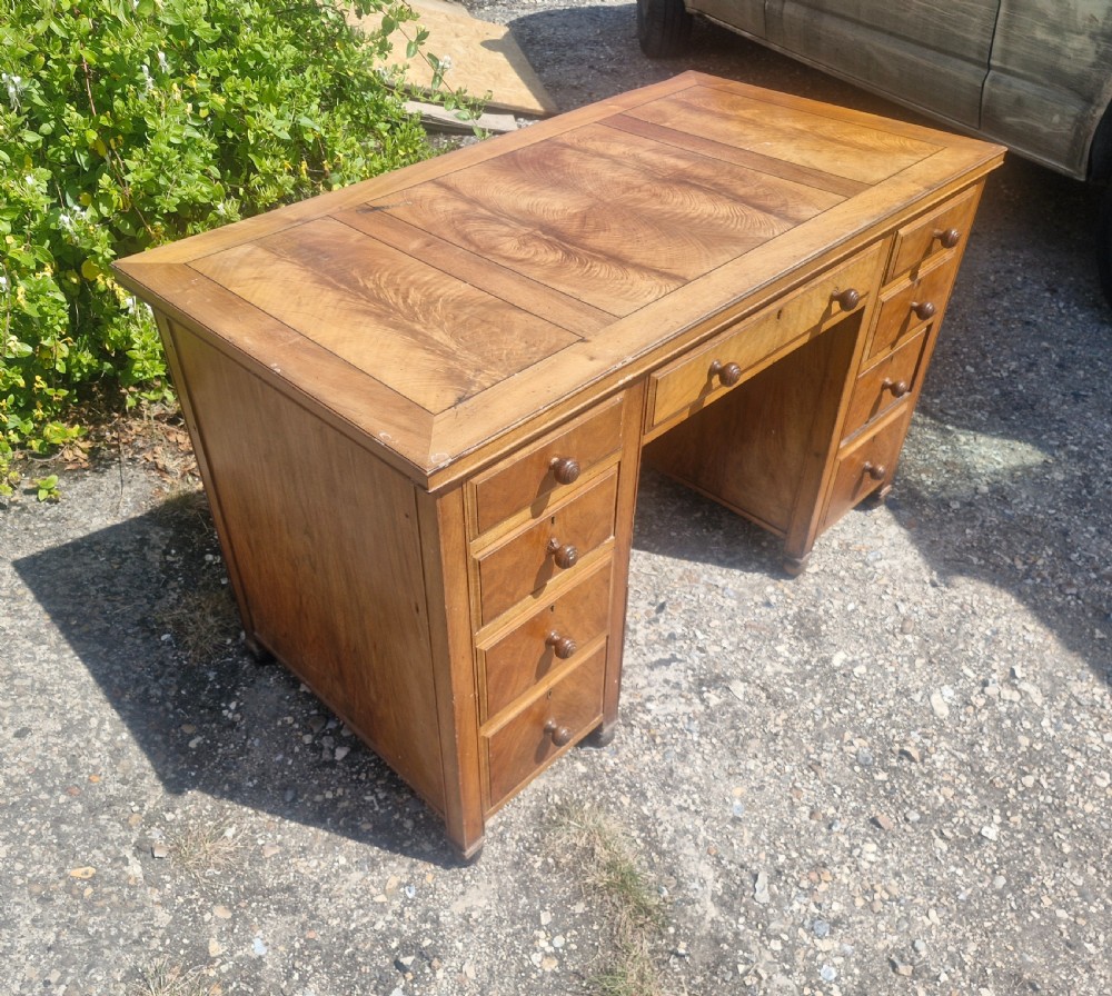 Walnut kneehole pedestal writing desk by Heals. View VI