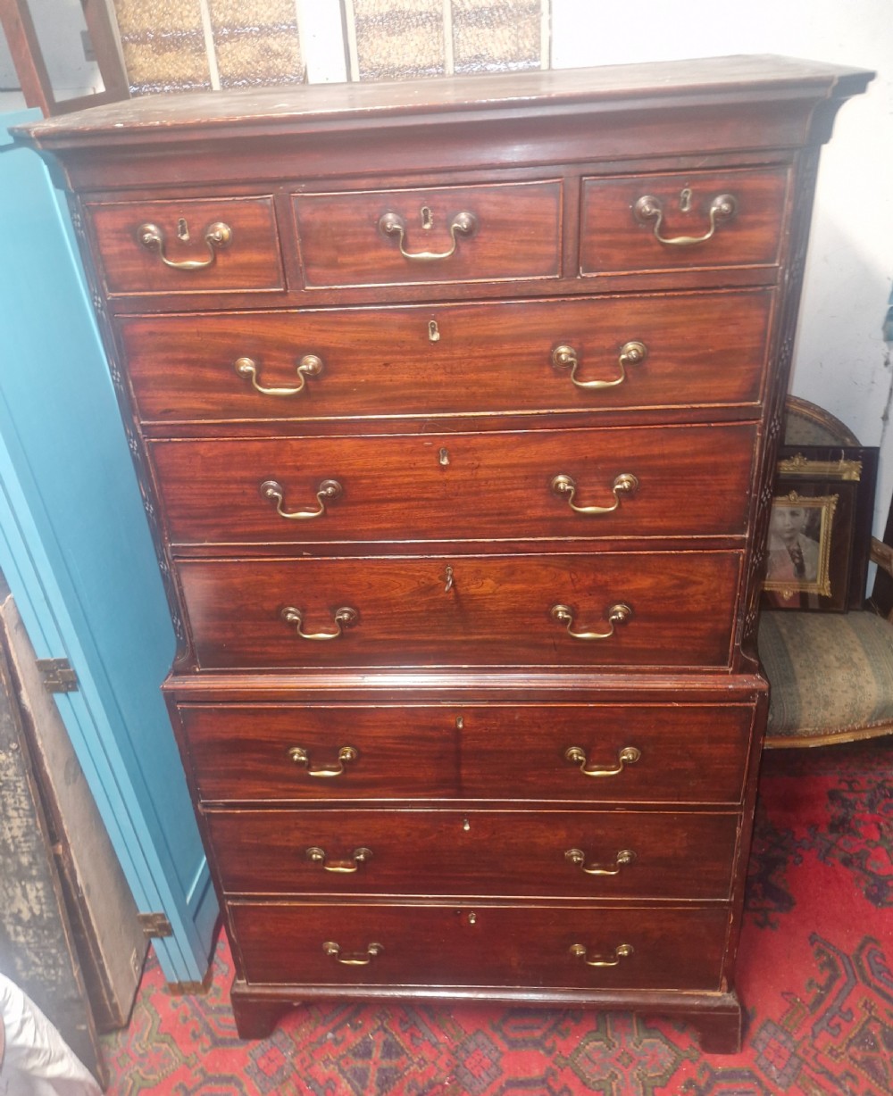 A late Georgian dark mahogany tallboy chest on chest with brass swan-neck handles and bracket feet. View II
