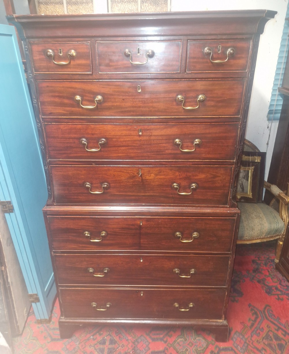 A late Georgian dark mahogany tallboy chest on chest with brass swan-neck handles and bracket feet. View III