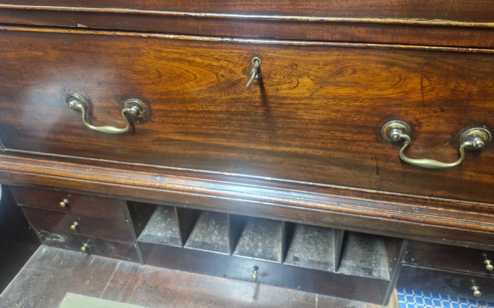 A late Georgian dark mahogany tallboy chest on chest with brass swan-neck handles and bracket feet. View IV