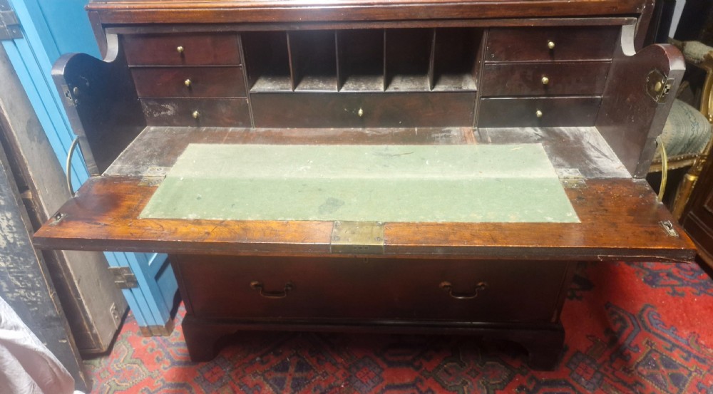 A late Georgian dark mahogany tallboy chest on chest with brass swan-neck handles and bracket feet. View VII