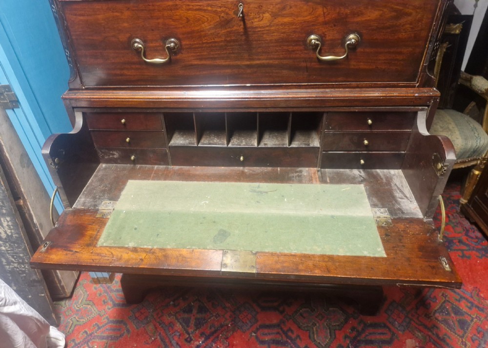 A late Georgian dark mahogany tallboy chest on chest with brass swan-neck handles and bracket feet. View VIII