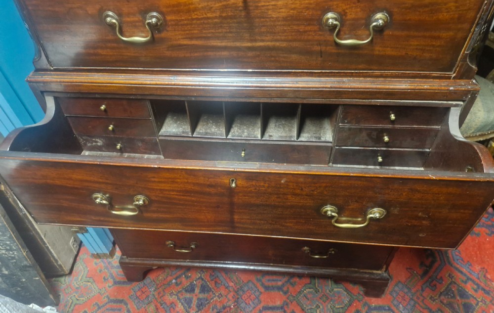 A late Georgian dark mahogany tallboy chest on chest with brass swan-neck handles and bracket feet. View IX