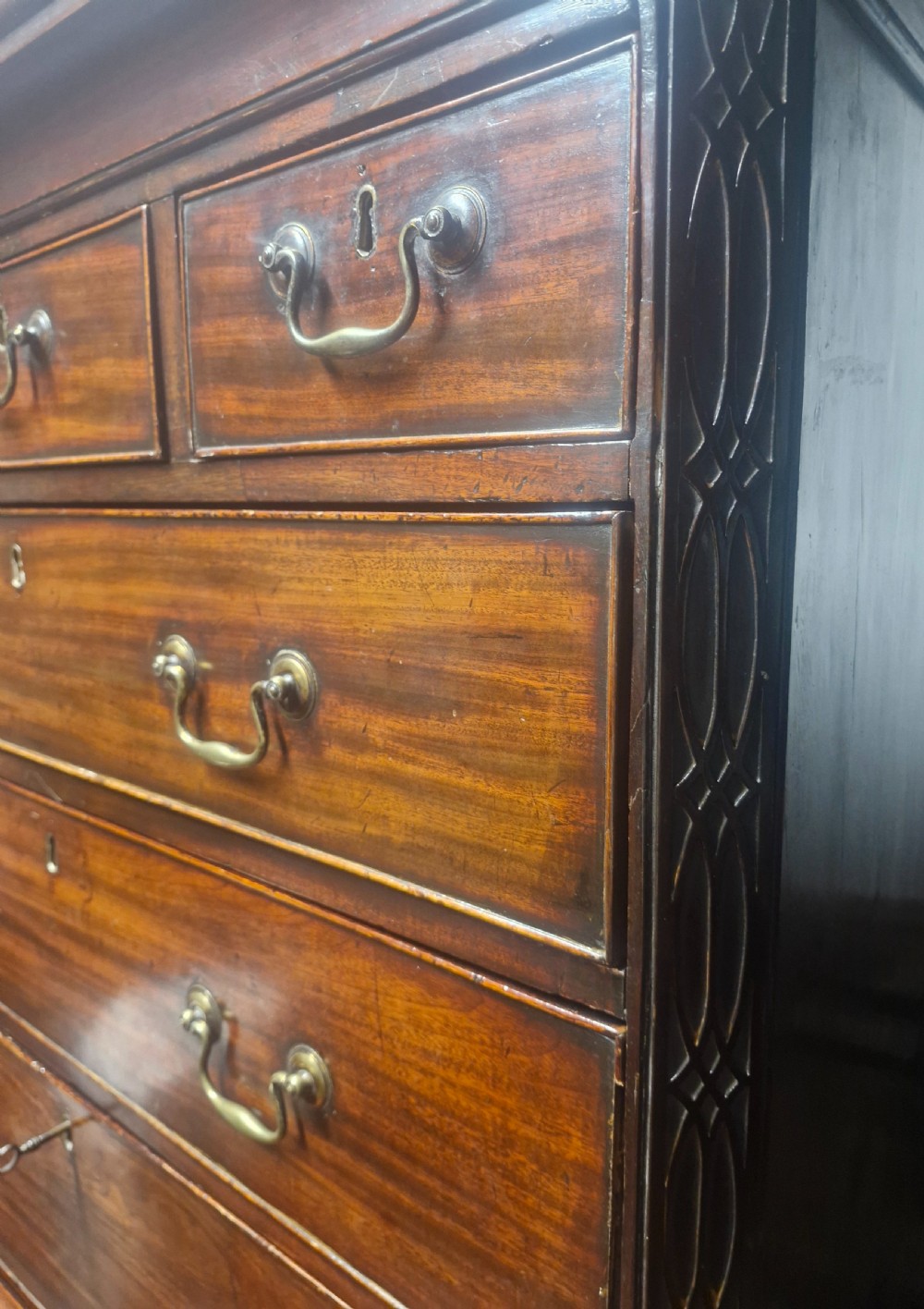 A late Georgian dark mahogany tallboy chest on chest with brass swan-neck handles and bracket feet. View X