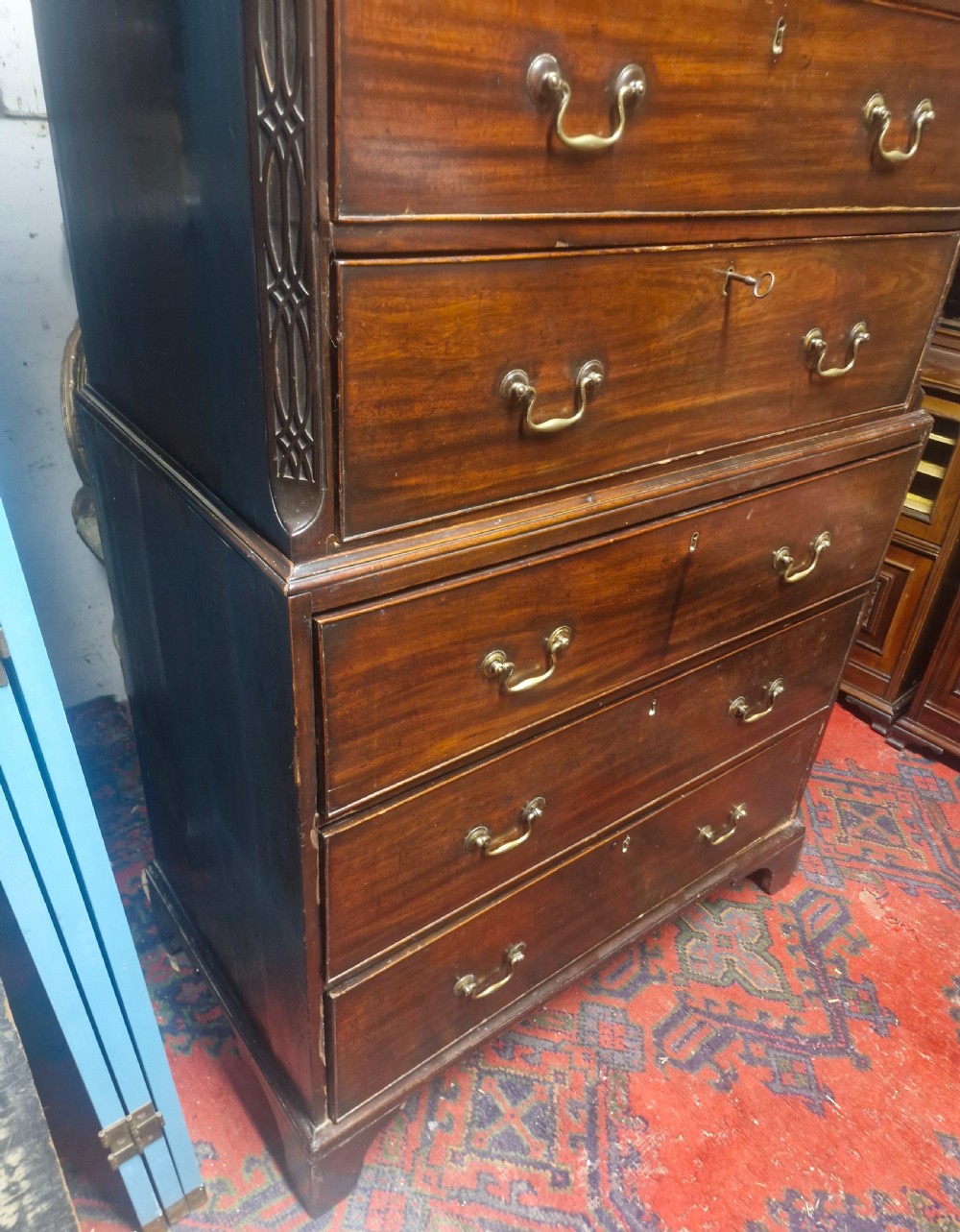 A late Georgian dark mahogany tallboy chest on chest with brass swan-neck handles and bracket feet. View XII