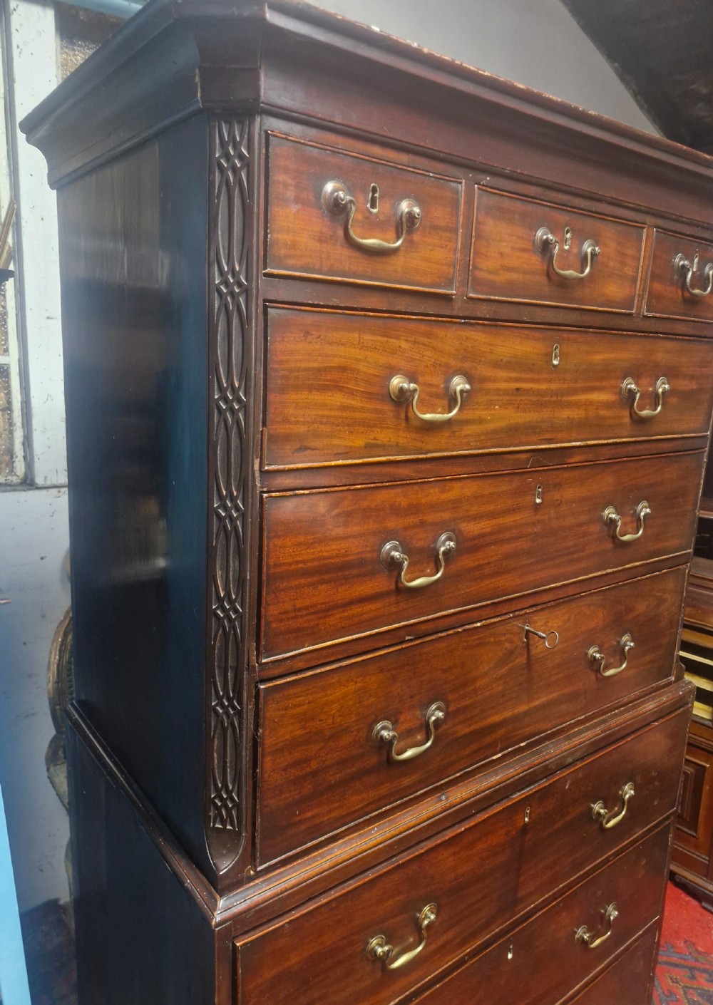 A late Georgian dark mahogany tallboy chest on chest with brass swan-neck handles and bracket feet. View XIII