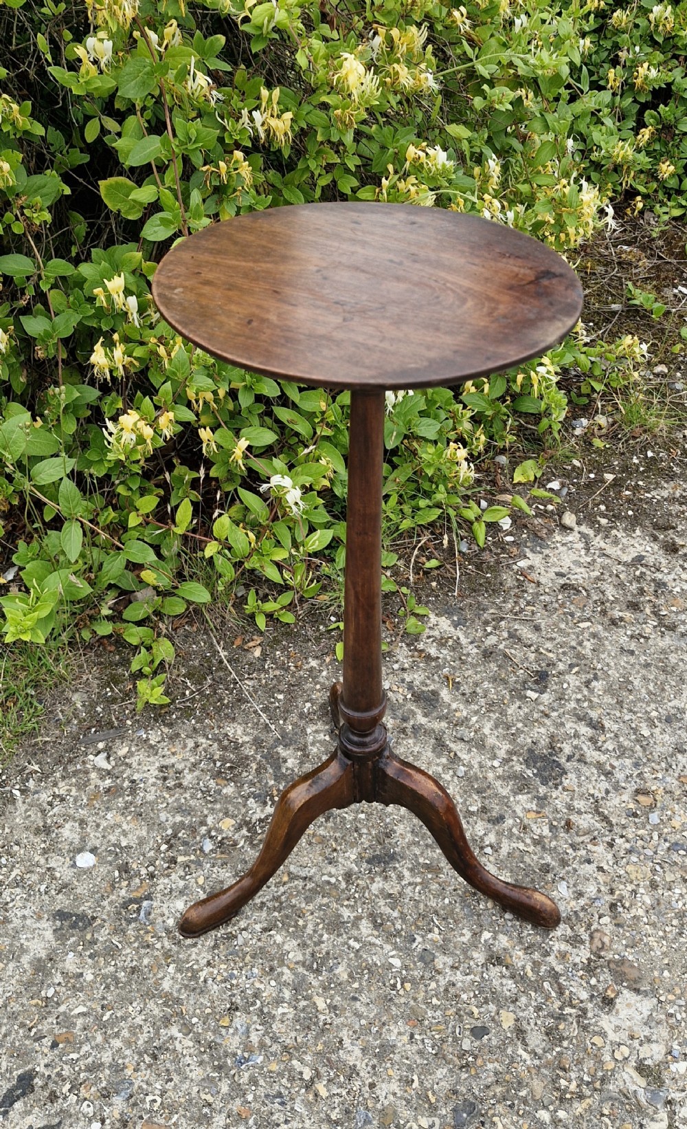 Antique mahogany and walnut candle stand. 