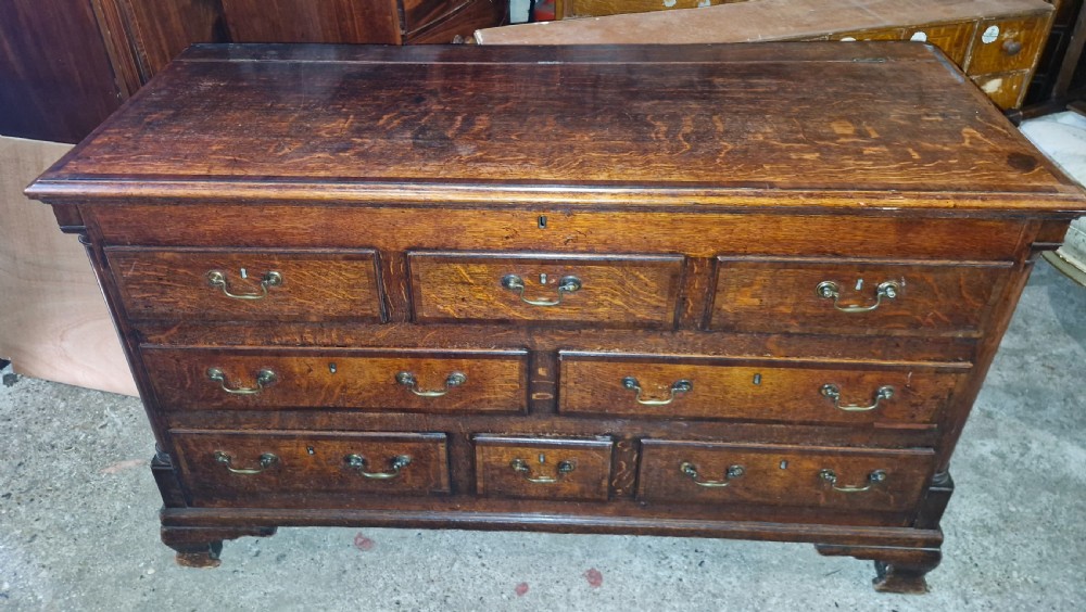 Small late Georgian oak and cross banded Lancashire mule chest. 