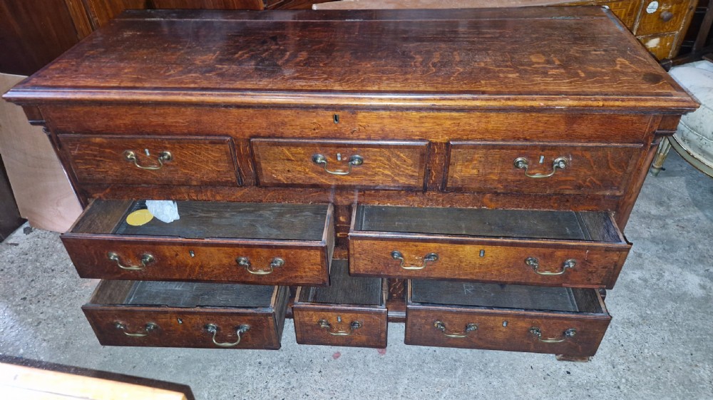 Small late Georgian oak and cross banded Lancashire mule chest.  View II