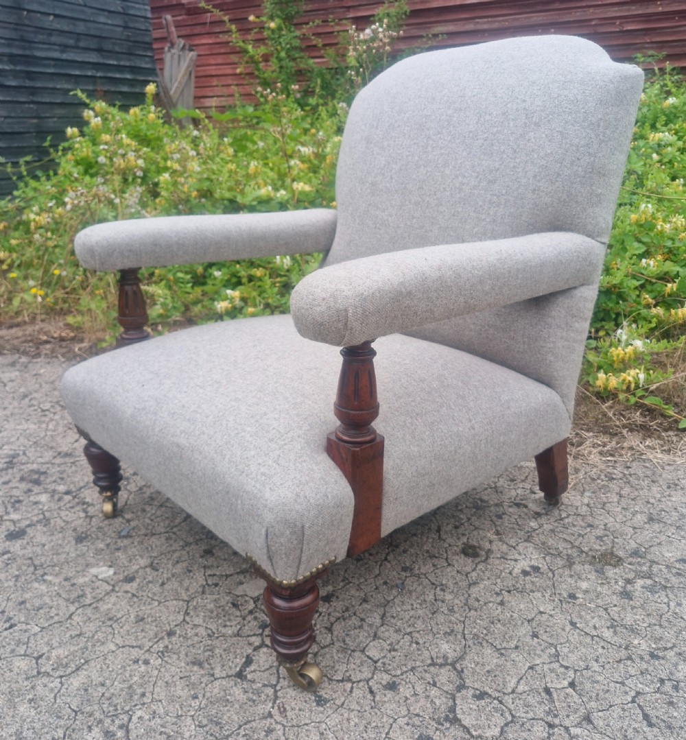 Victorian upholstered armchair with stamp to back leg. View II