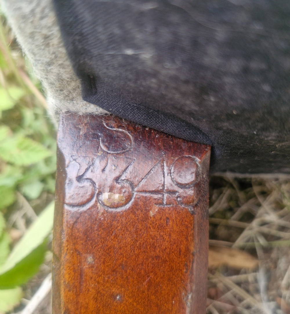 Victorian upholstered armchair with stamp to back leg. View V