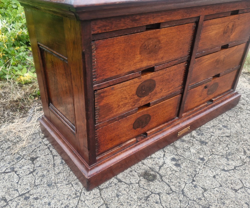 A 19th-century Victorian wooden tabletop Amberg filing cabinet with indexed drawers and an upper spring-loaded letter binder. View III