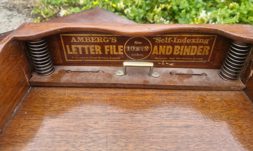 A 19th-century Victorian wooden tabletop Amberg filing cabinet with indexed drawers and an upper spring-loaded letter binder. View VII