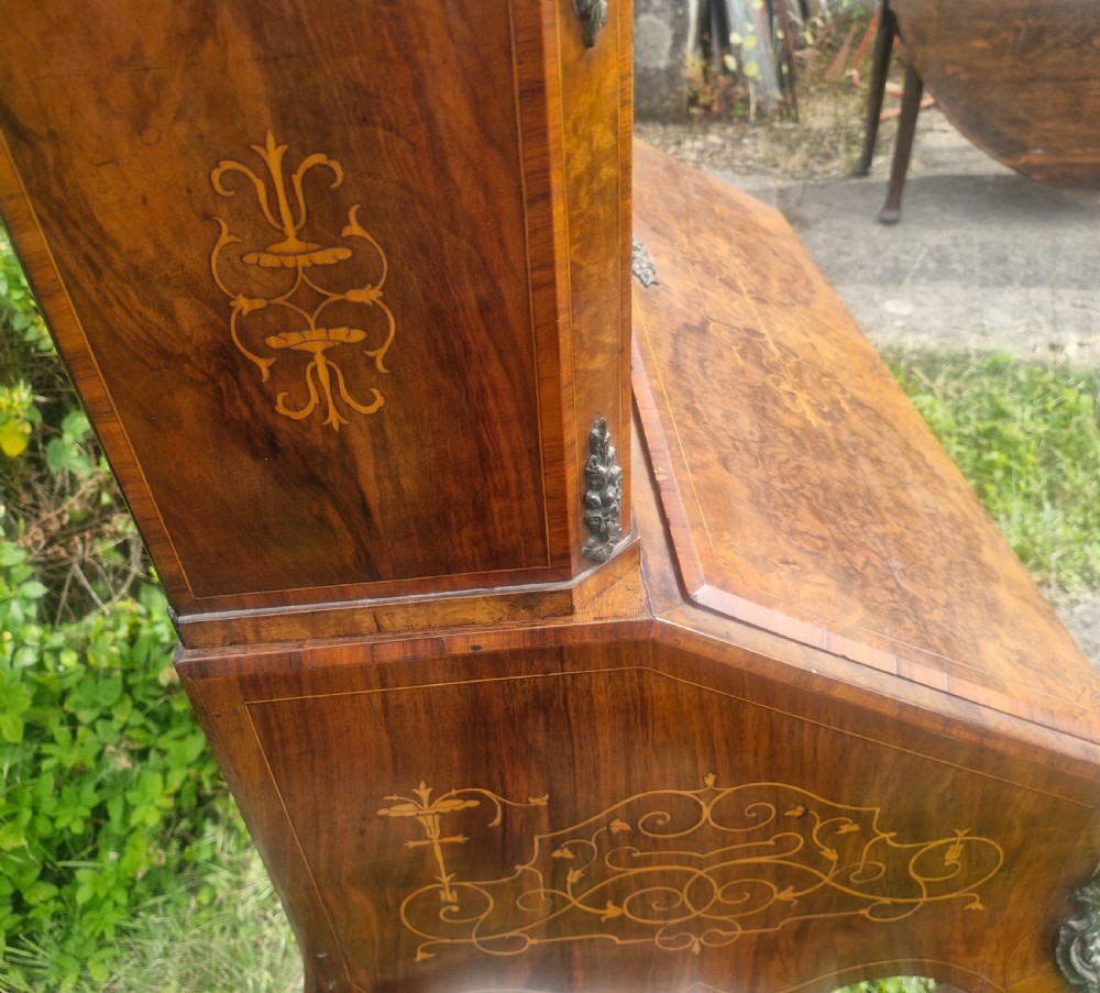 A Victorian burr walnut bonheur du jour writing desk featuring floral marquetry inlay, cabriole legs, a slant front slope, and a mirrored upper superstructure with glazed cabinets. View III