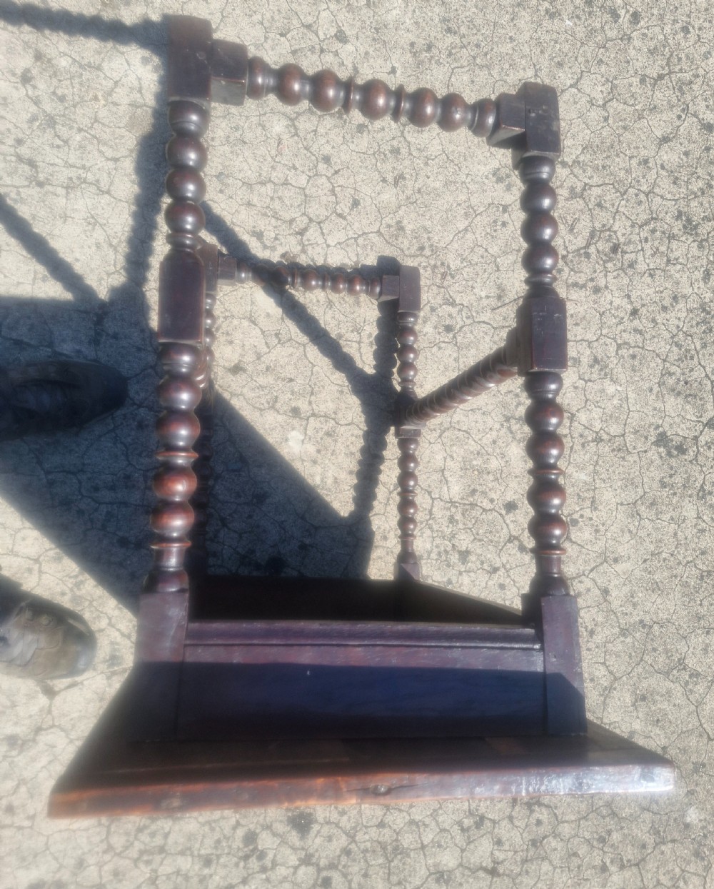 A mid-18th century dark oak side table featuring bobbin-turned legs and perimeter stretchers. View IV