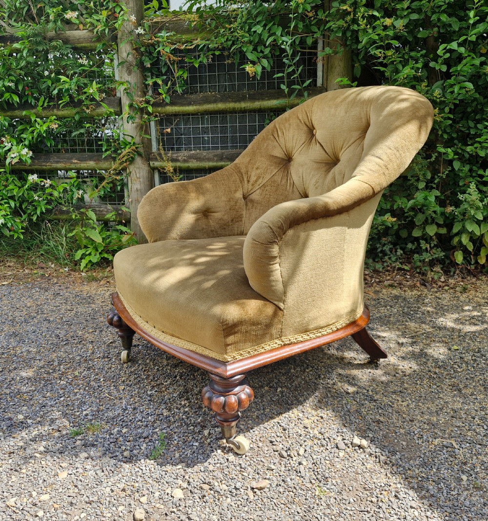 Good rosewood framed deep upholstered armchair. 