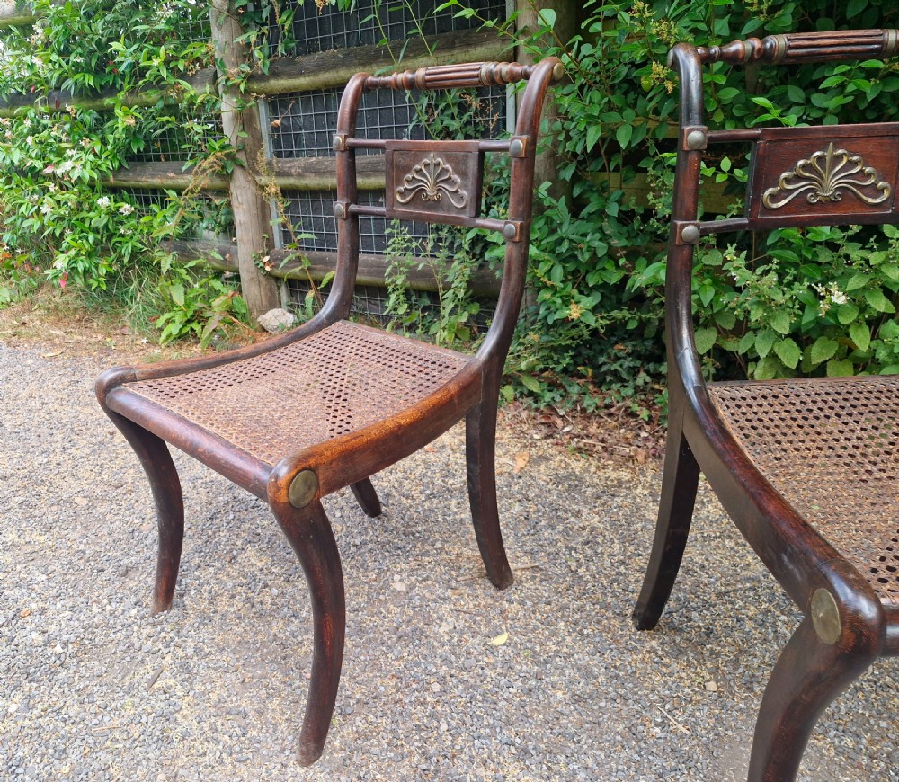 Pair of Regency brass mounted cane seat bedroom chairs.  View III
