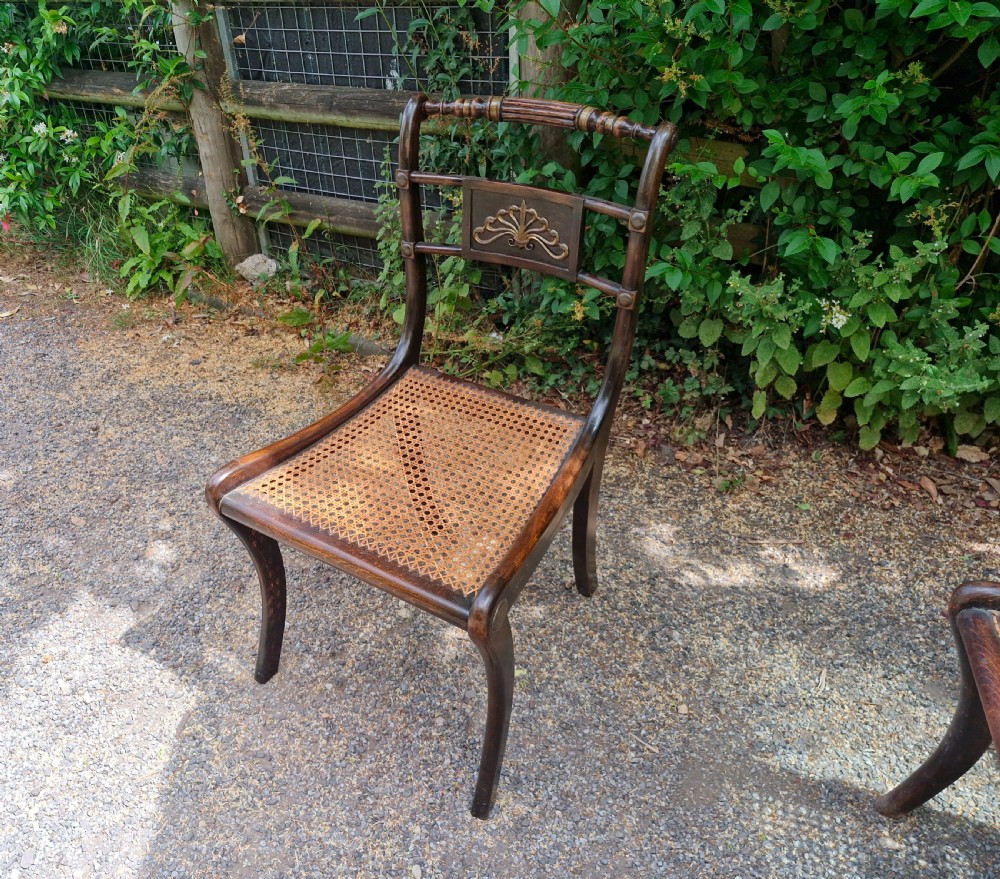 Pair of Regency brass mounted cane seat bedroom chairs.  View IX