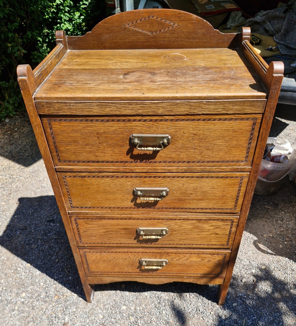 Edwardian oak inlaid arts and crafts chest of drawers. 