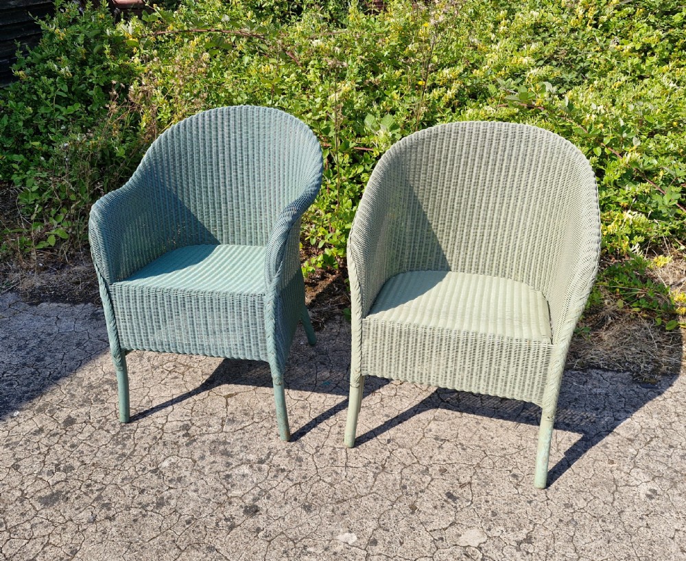 Pair of matched Lloyd Loom armchairs.