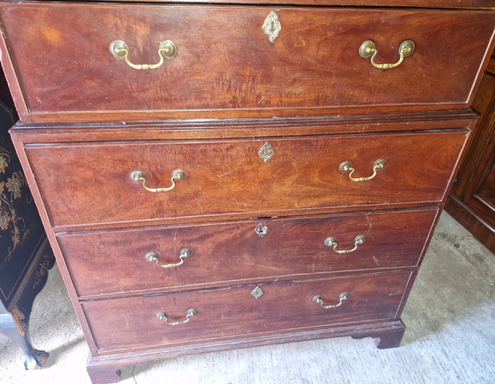 A late Georgian tall mahogany chest on chest featuring two short drawers over six long drawers with brass handles and a dentil cornice. View III