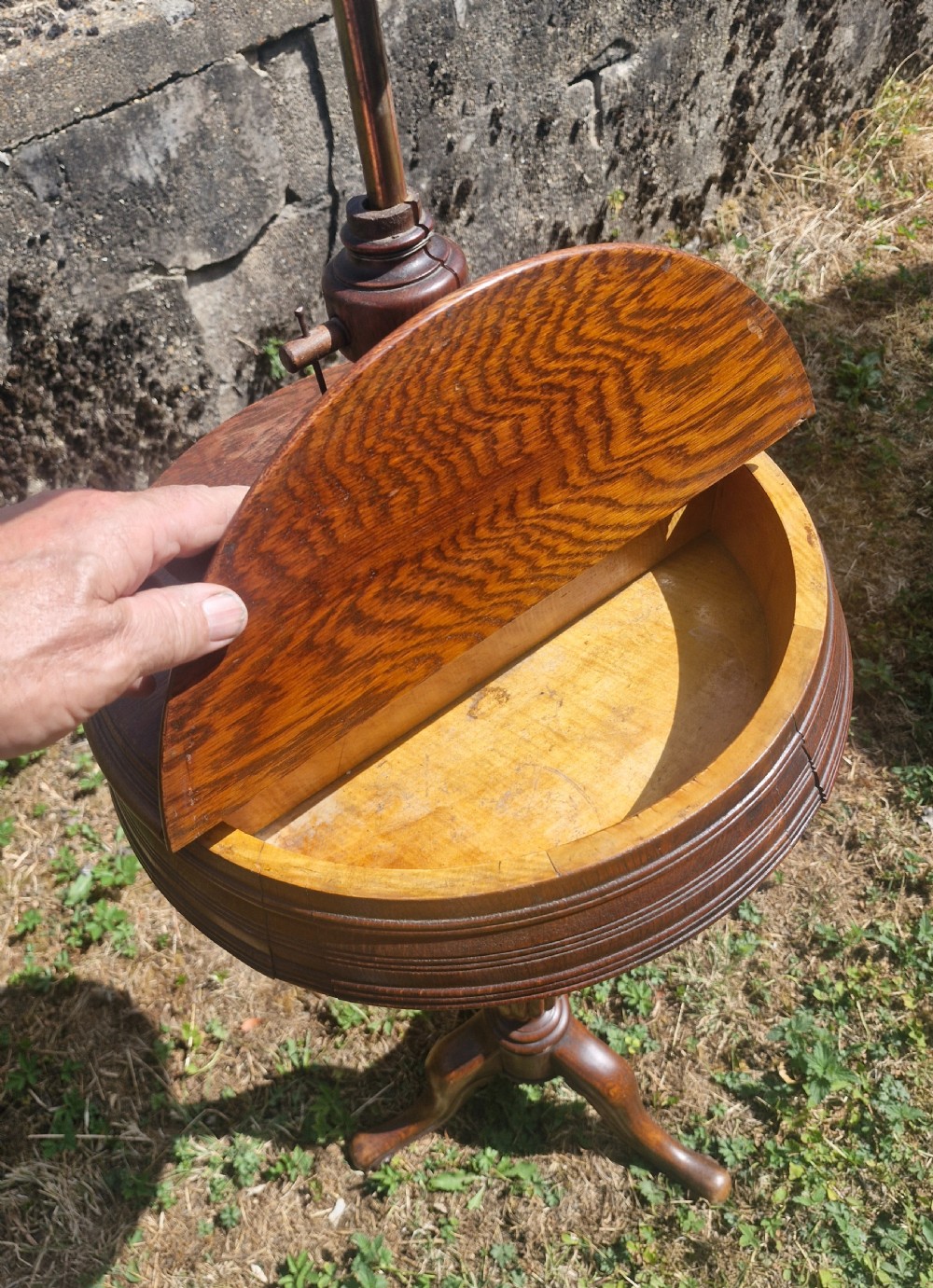 A Victorian dark oak shaving stand featuring an adjustable circular mirror mounted above a round surface, supported by a turned pedestal and tripod cabriole legs. View II