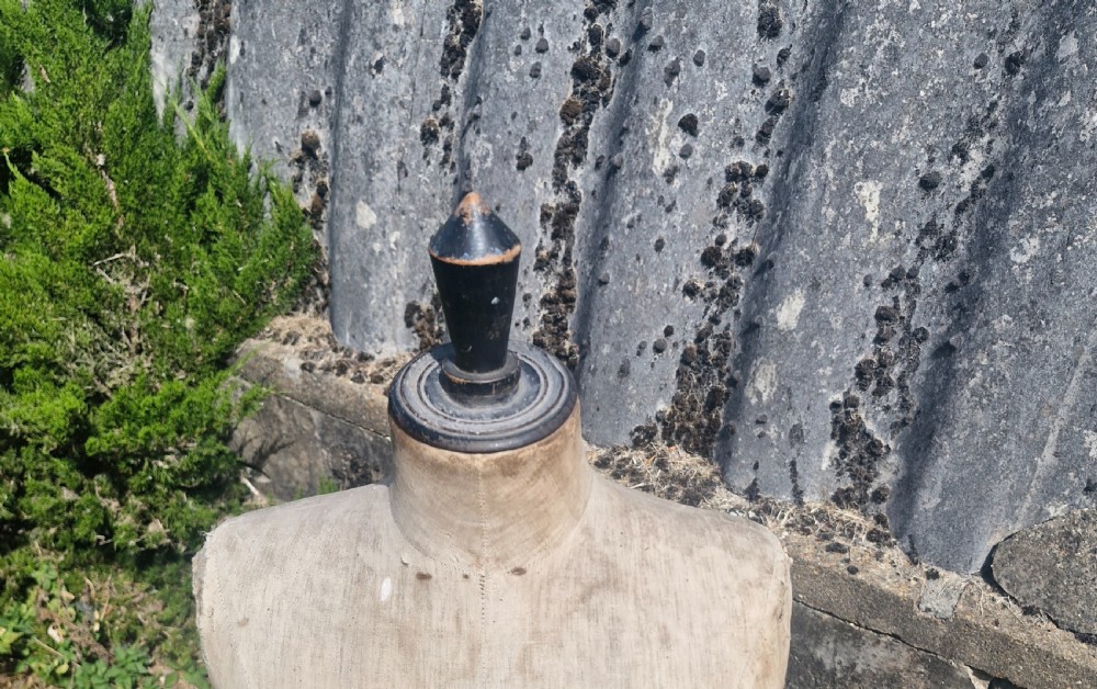 An early 20th-century dressmakers mannequin with a distressed beige linen torso on a turned wooden tripod stand. View II