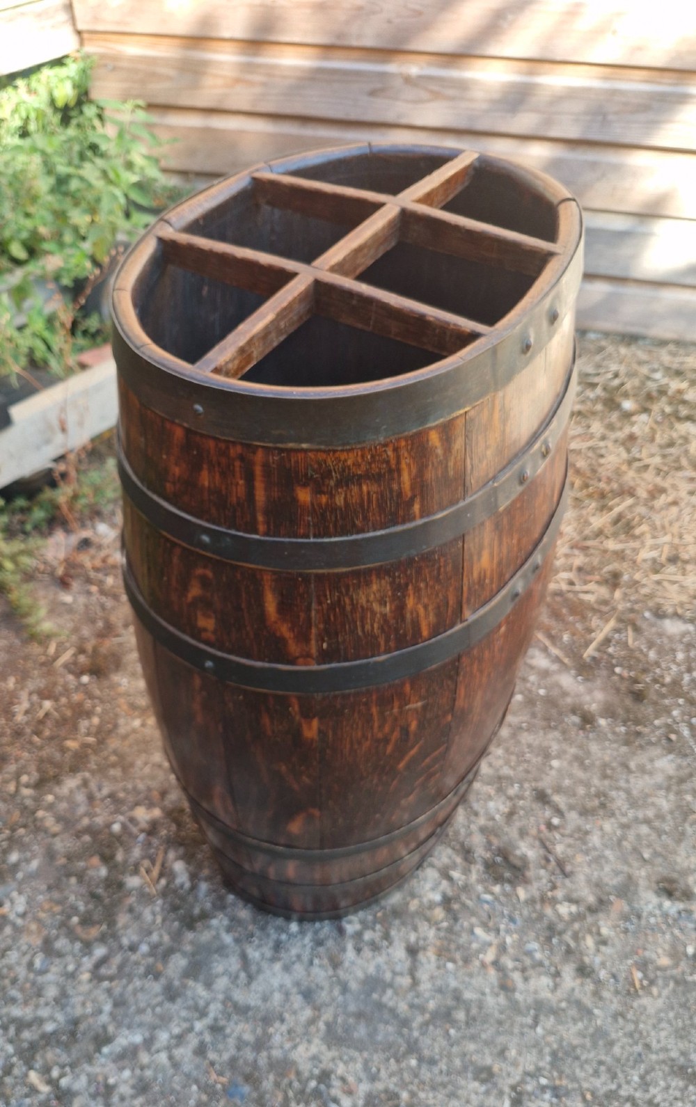 A dark oak coopered barrel stick stand featuring metal binding hoops and a six-section wood divider at the top. View II
