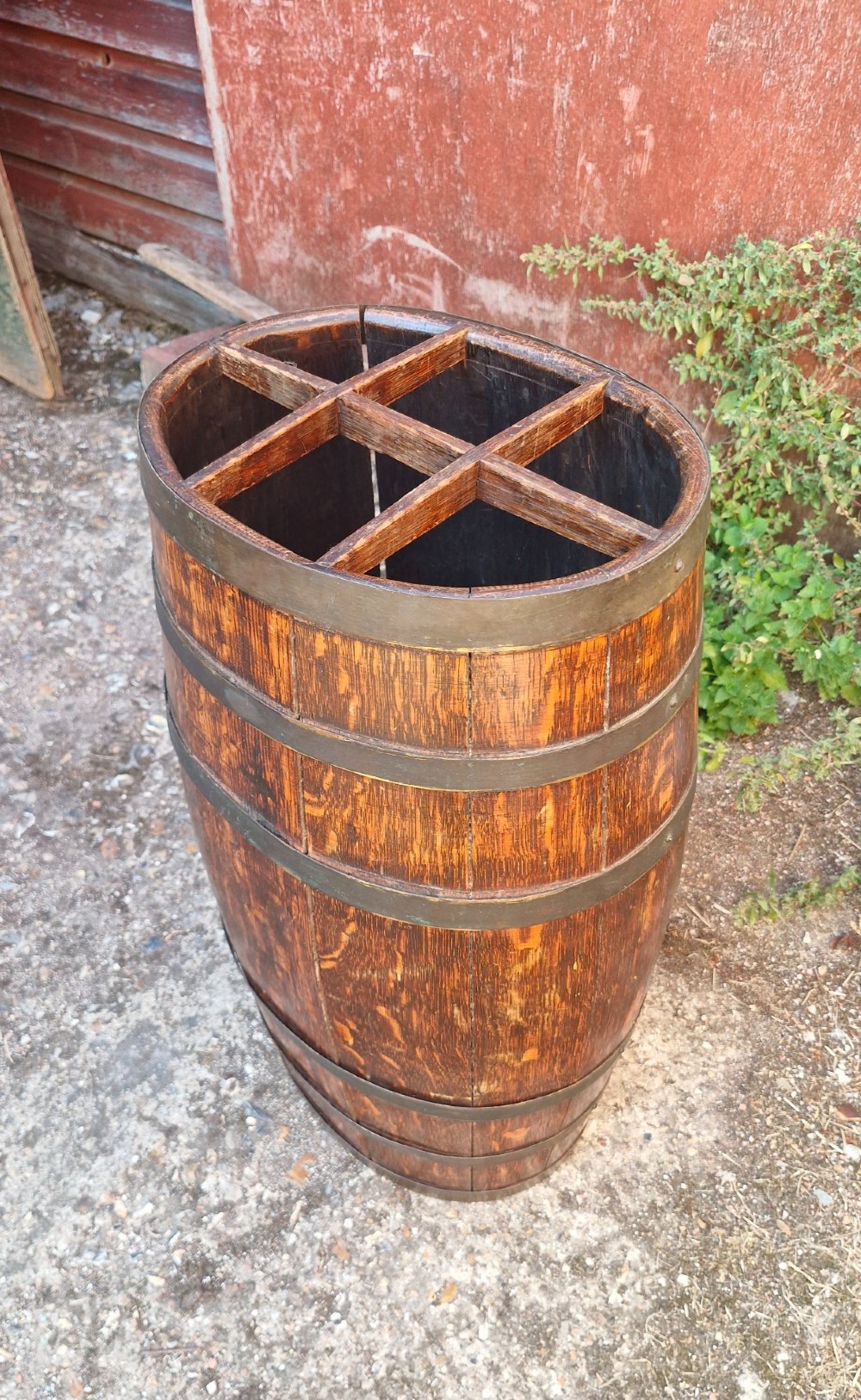 A dark oak coopered barrel stick stand featuring metal binding hoops and a six-section wood divider at the top. View IV