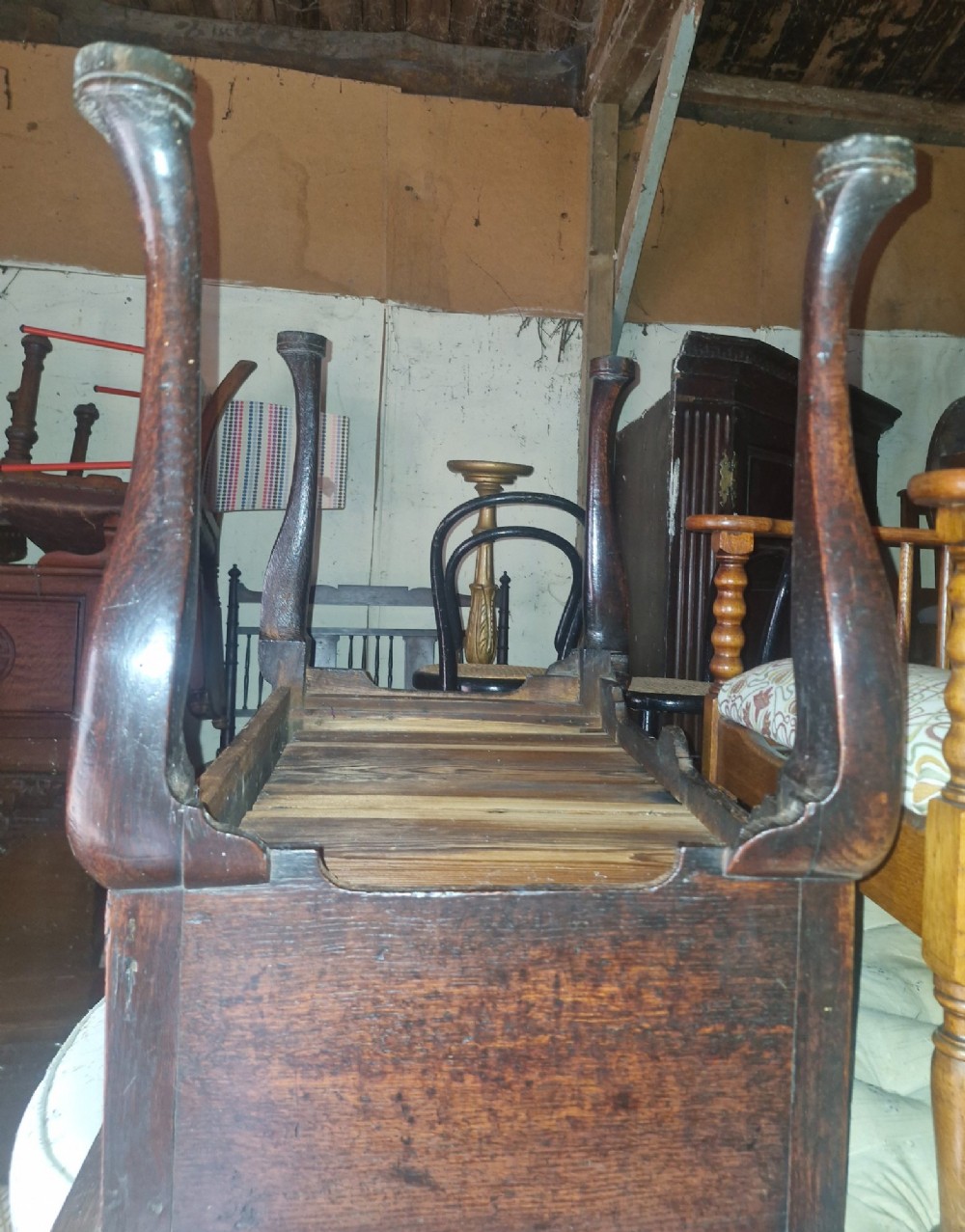 A mid-18th century dark oak side table with three drawers, brass handles, and cabriole legs on pad feet. View VII