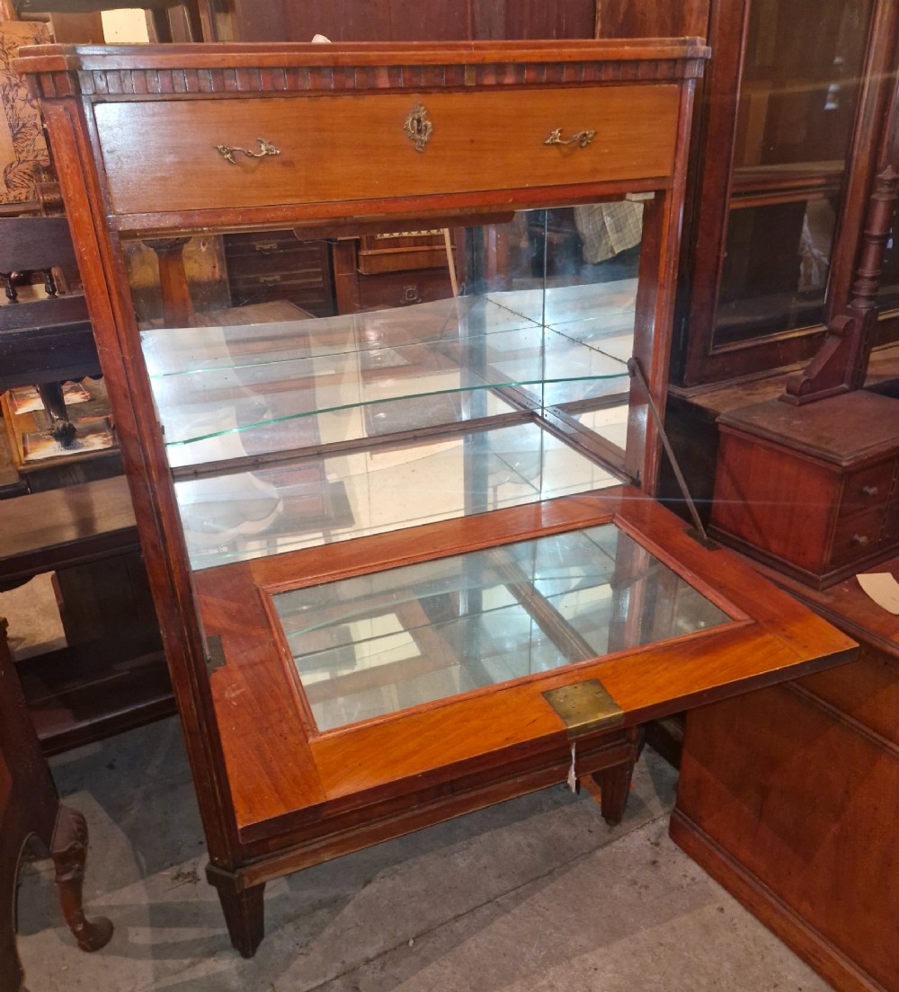 Antique mahogany secretaire cocktail cabinet featuring chevron wood veneer inlays, brass corner mounts, drop-front panel, upper drawer, and lower double doors. View VIII